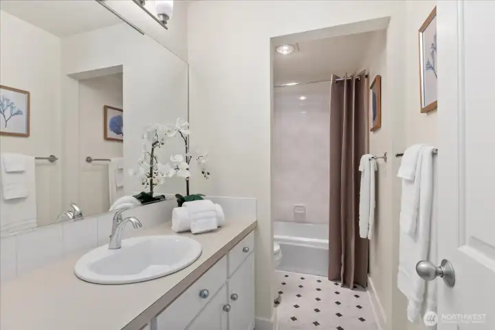 Main floor bath with bathtub/shower.