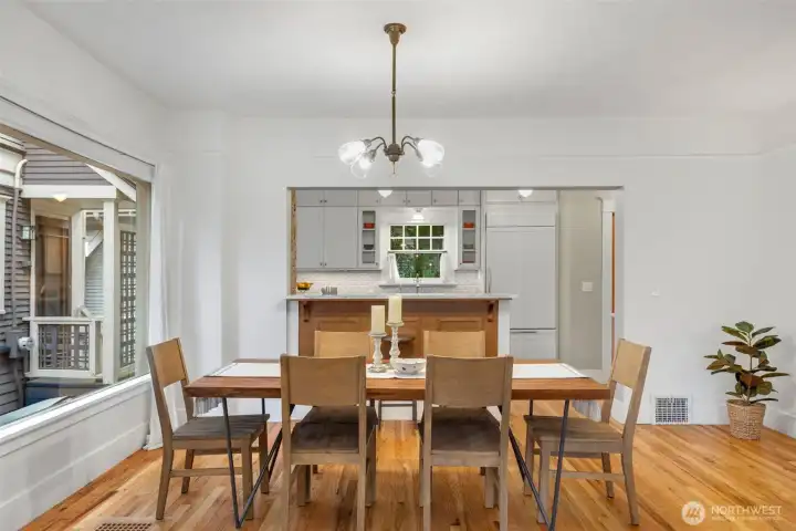The wall to the kitchen was opened up in the  kitchen remodel for nice flow between the  spaces.