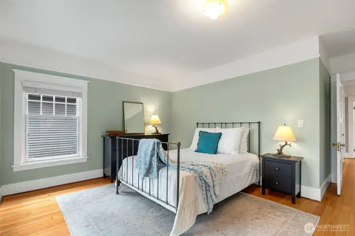 The Primary bedroom is large enough for a  Kind bed as well as a dresser and side tales.