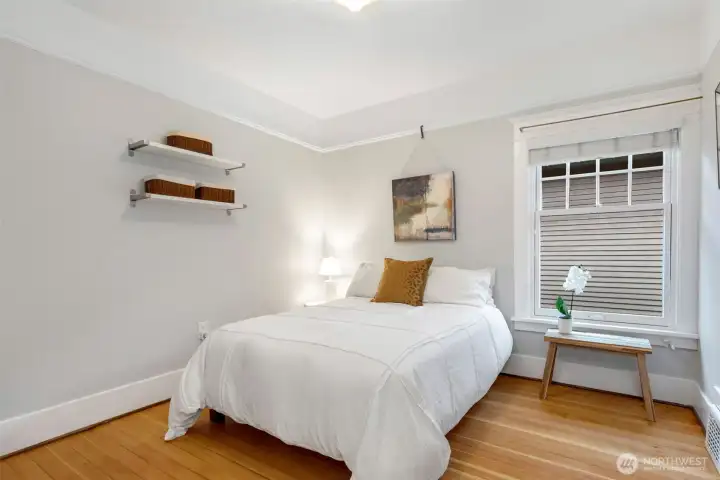 The second upstairs bedroom with wood floors and nice natural light.