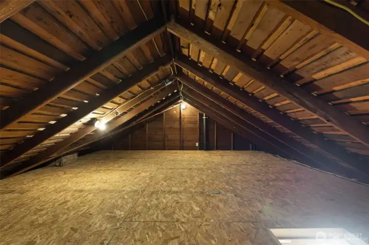 The attic is unfinished, but clean and dry  with floors installed over the insulation, and  offers lots of great storage!