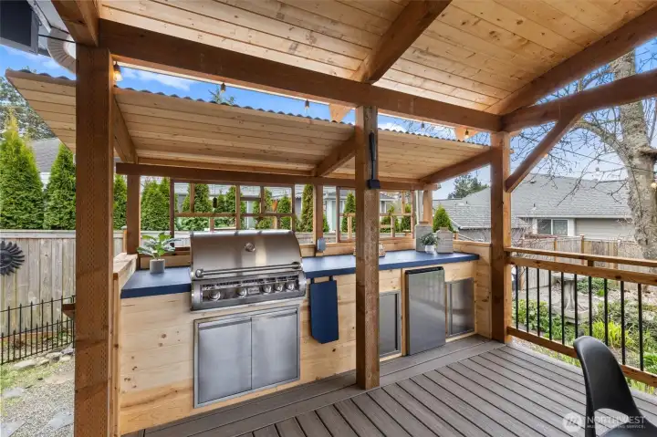 Built-in BBQ area with fridge.