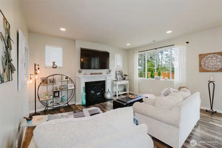 Family room with fireplace and tons of natural light