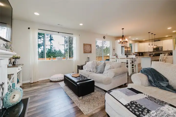 Family room with fireplace and tons of natural light