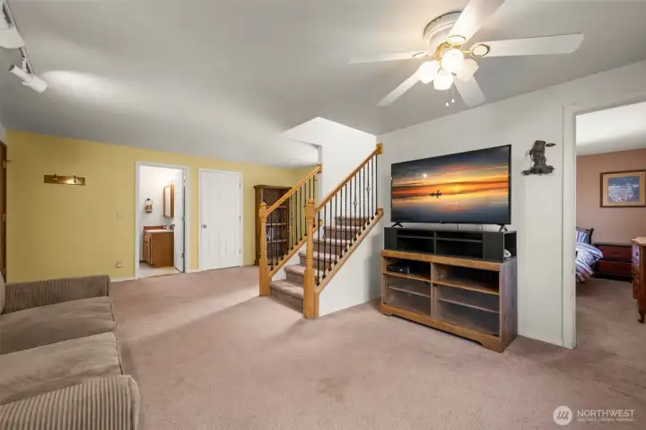 Cozy downstairs living space with stove.