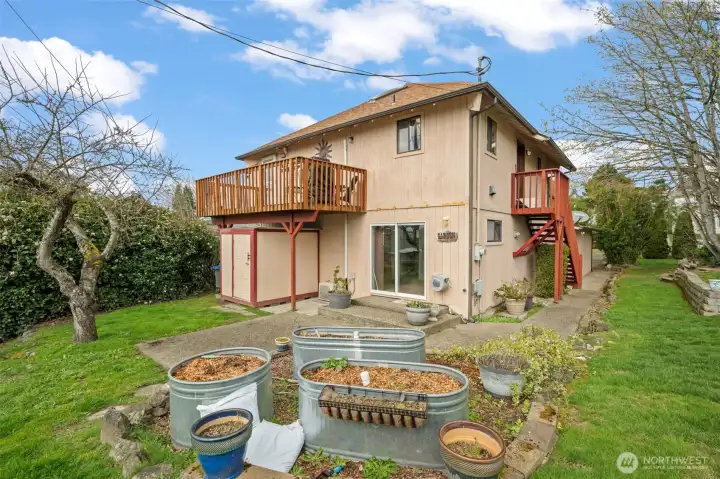 Multiple outdoor living spaces and gardening areas