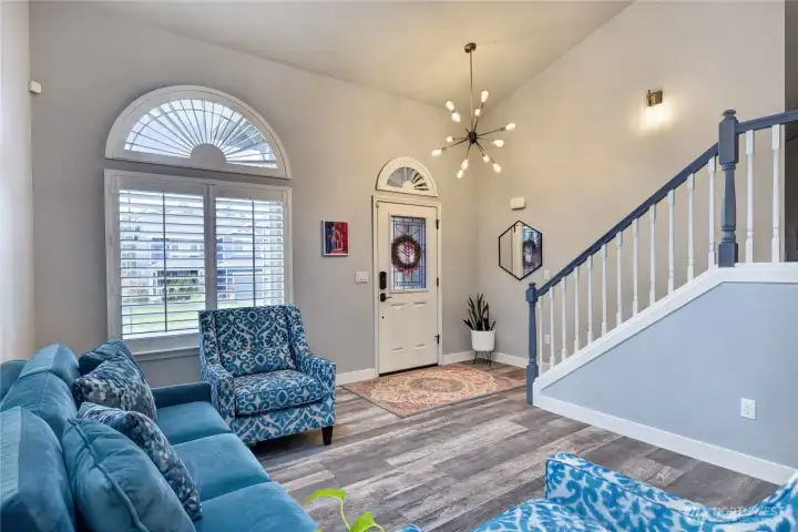 Grand entrance with vaulted ceilings and skylights.