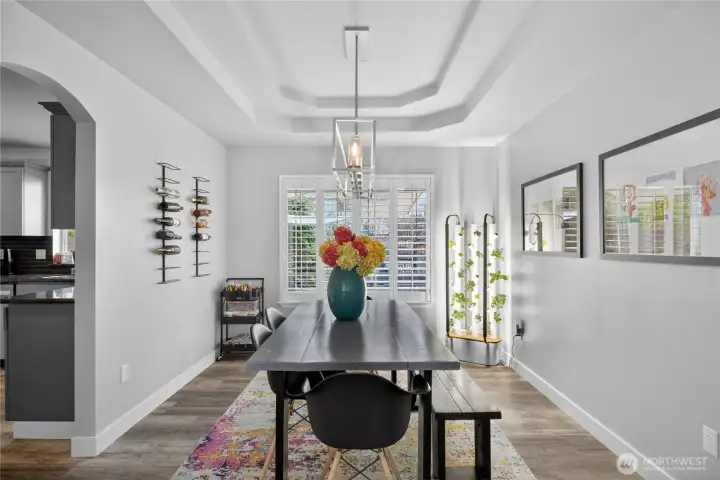 Separate dining room with tray ceiling.