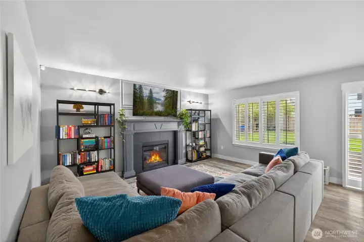 Spacious family room with cozy fireplace.