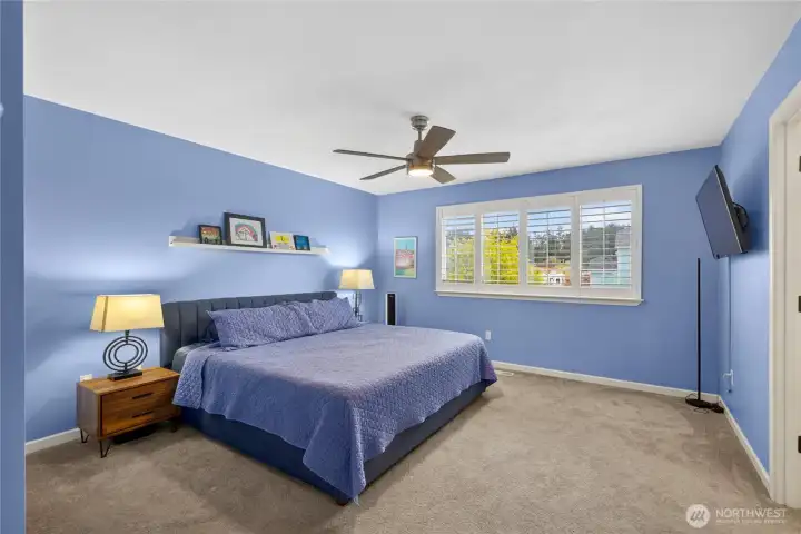 Primary bedroom is spacious with room to spare.