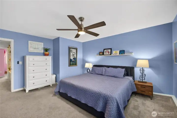 Primary bedroom has tons of natural light.