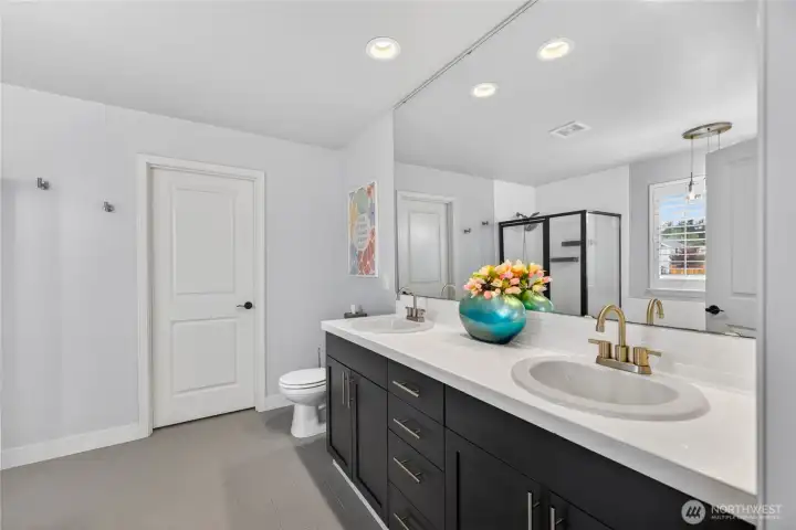 Dual vanity and walk-in closet in the ensuite.