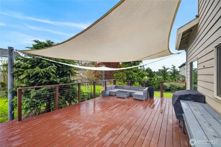 Back deck is newly painted and features a removable sun-shade canopy.