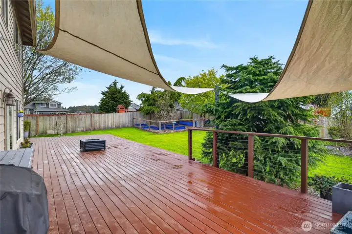 Back deck features a plumbed propane fire pit.
