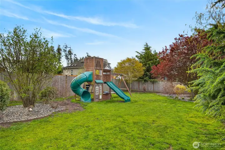 Playground and plenty of space in the shy half-acre lot.