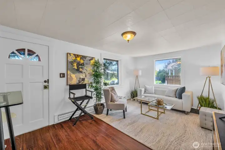 Light bright living room with big double pane windows.