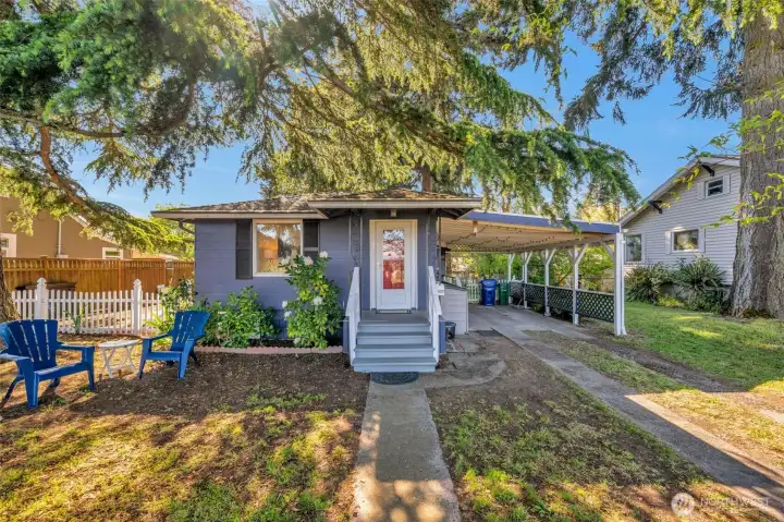 Nice size carport with electric car charger.