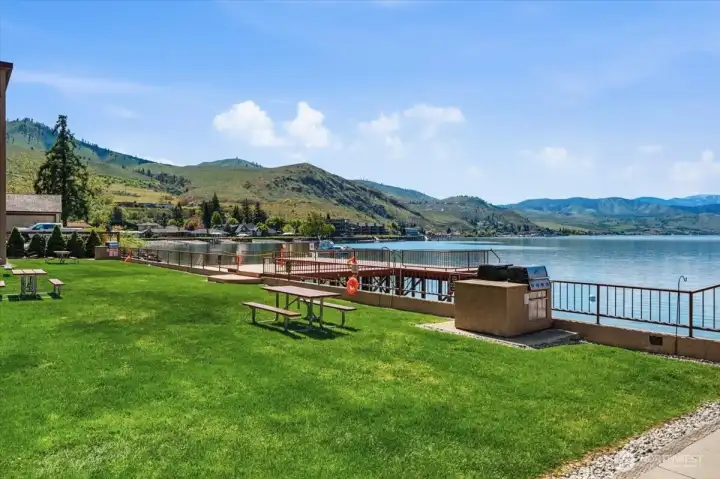 Enjoy resort-style lake living with a pool, hot tub, dock, and expansive green space.