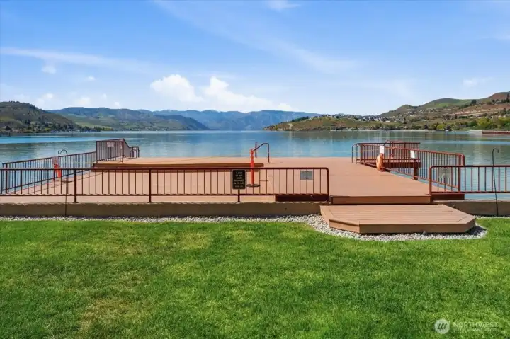 Experience resort-style living with lakefront pool, hot tub, dock access, and guest buoys.