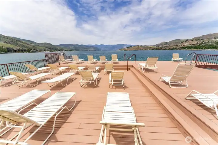Enjoy resort-style lake living with a pool, hot tub, dock, and expansive green space.
