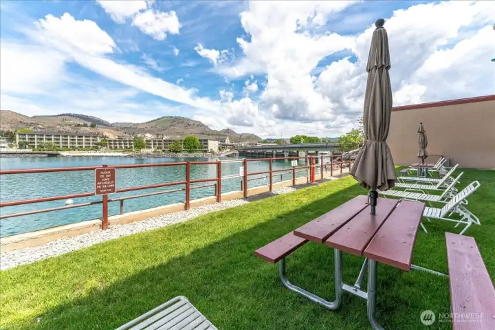 Enjoy resort-style lake living with a pool, hot tub, dock, and expansive green space.