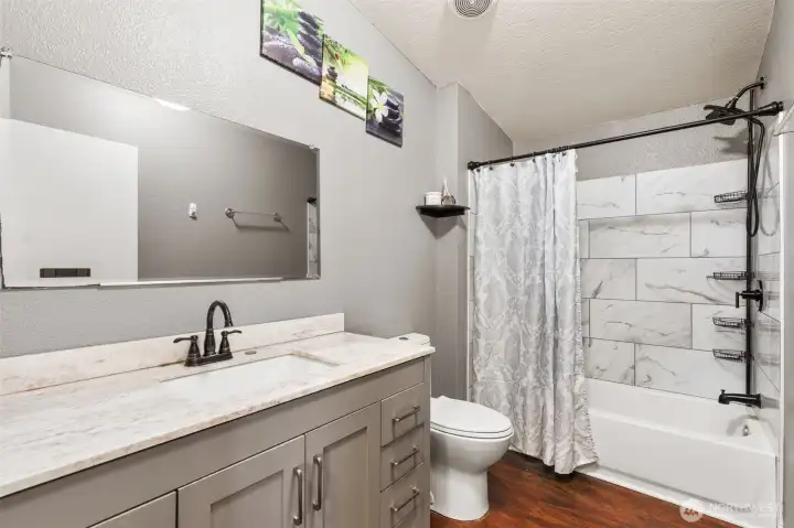 Beautiful Main Bathroom with Tile Tub Surround