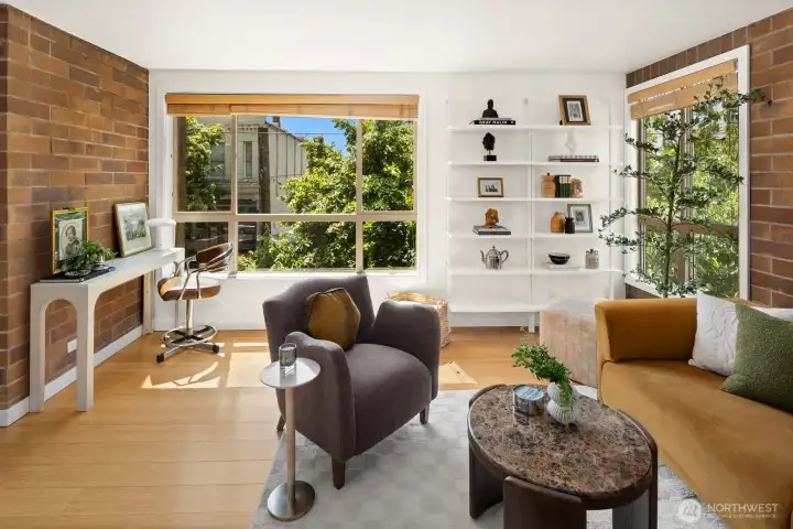 Sunlight pours in through oversized north-facing windows, creating a bright, comfortable space that feels welcoming all day long.