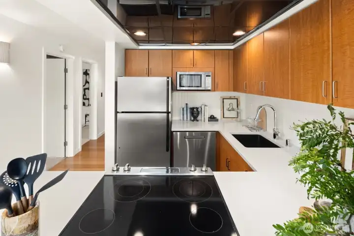 Recently updated with clean lines, generous prep space, and thoughtful storage, this kitchen is as functional as it is stylish.