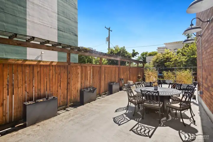 Gather with neighbors, enjoy dinner outdoors, or soak up the sunshine in the building's shared patio space.