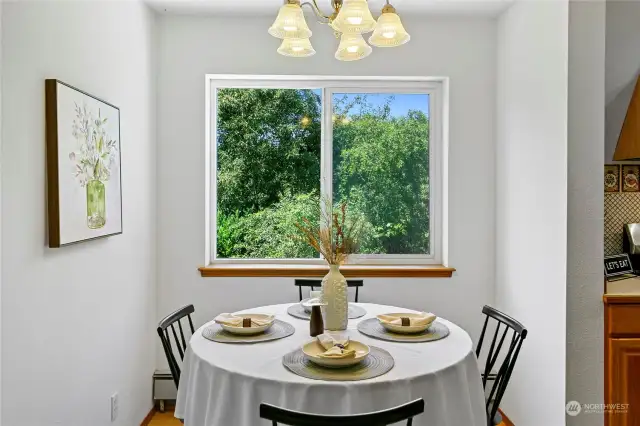 And into the sweet dining nook - perfectly sized for meals, conversations, homework - and right off the main floor kitchen!