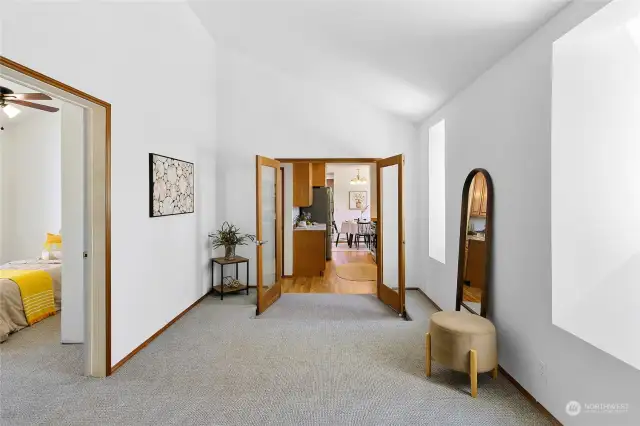 Looking back through the doors towards the kitchen, and to the left you can see an additional space for sleeping... or is it your new walk-in closet?