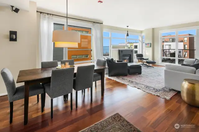 This view is from the kitchen looking northwest to the dining area and onto the living room.  Designer color palette, gorgeous finishes and great walls for art.