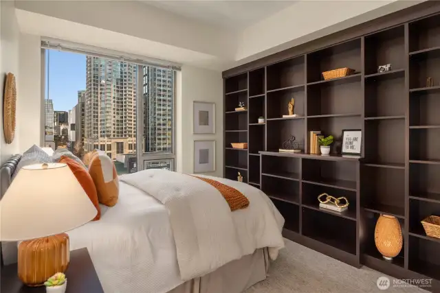 The second bedroom is equally stunning with a full wall of California Closets shelving. A spacious closet is off to the right.