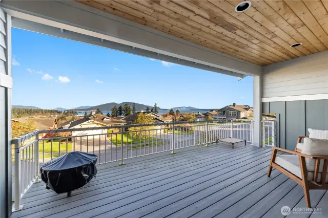 Deck off living room that is covered on three sides.