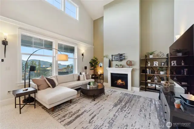 Cozing living come complete with a fireplace.