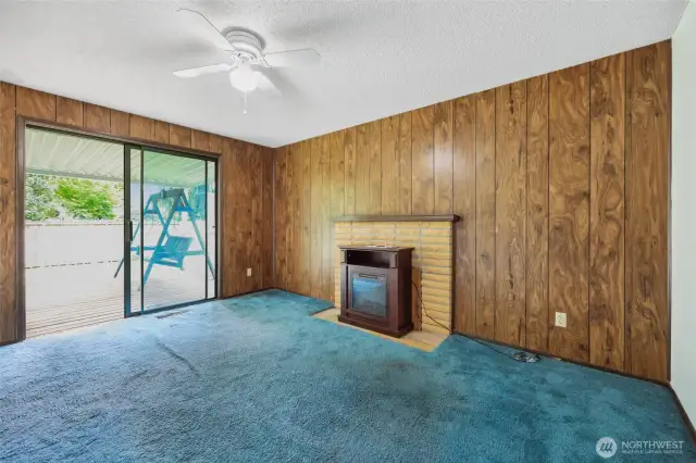 Seller hasn't used the fireplace in ages- electric option stays.  Oversized sliding glass doors to the covered back deck.