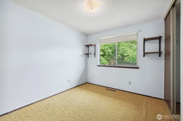 Second bedroom facing the backyard.