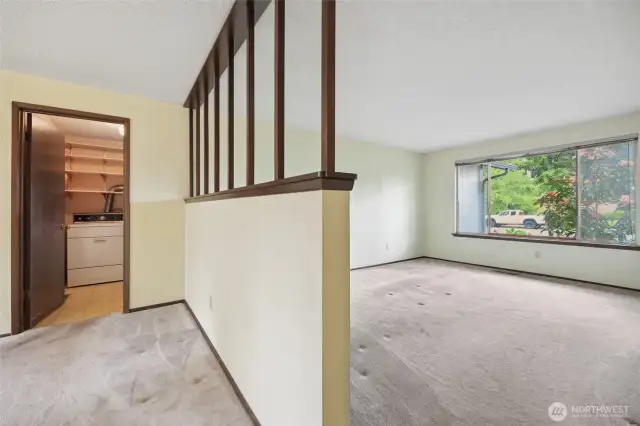 Divides the space & near the Utility Room.