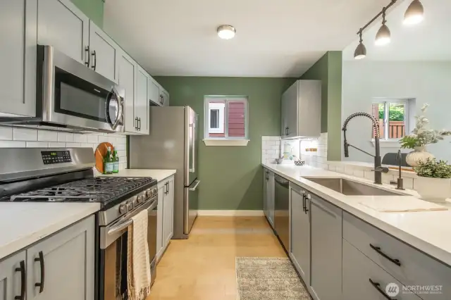 Stylish and functional kitchen with quartz counters, subway tile backsplash, and plenty of storage.