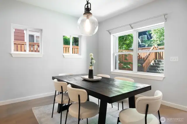 Spacious dining room with great natural light and a view out to the private fenced yard.