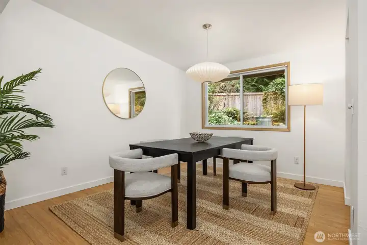 The dining room showing as seating for four is generously sized and can easily accomodate a larger table.