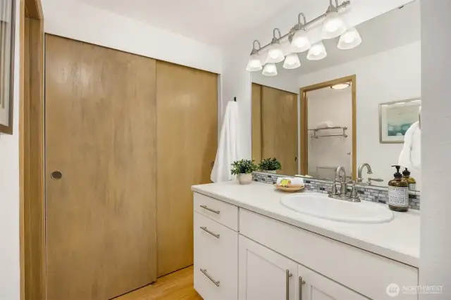 Full bath off primary with additional closet space.