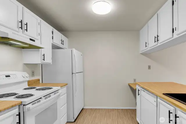 Freshly painted white kitchen cabinets.