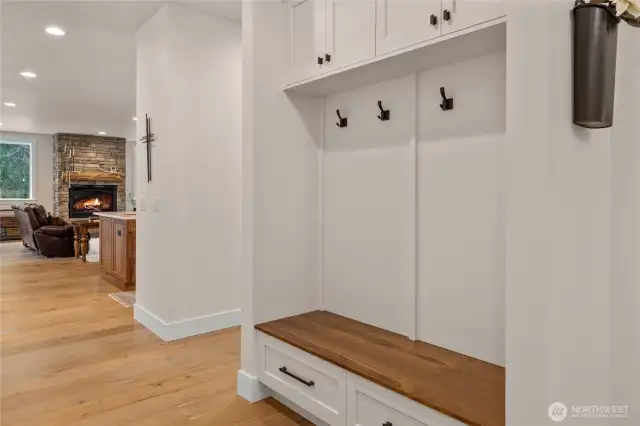 Custom entry bench with walnut top gives you a little preview of what is to come in the kitchen.
