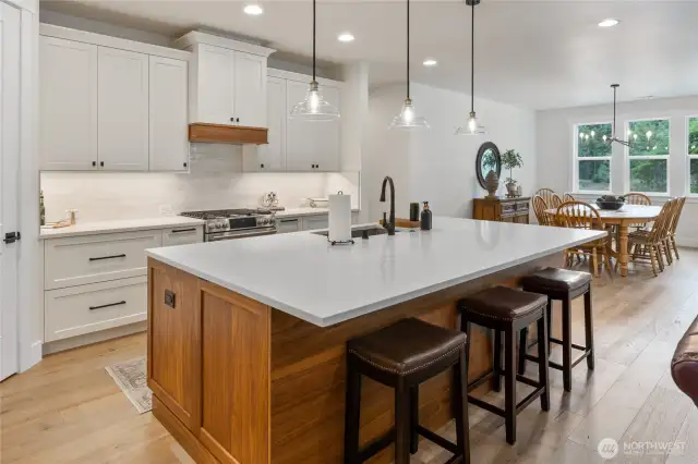What a great entertaining space.  The end cabinets have a top hidden handle for easy access to additional storage space!