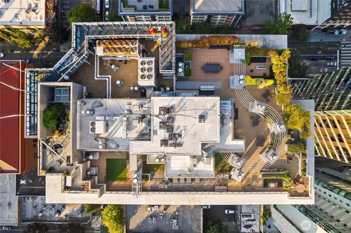 Large sky terrace with several distinct spaces to relax, BBQ, and more