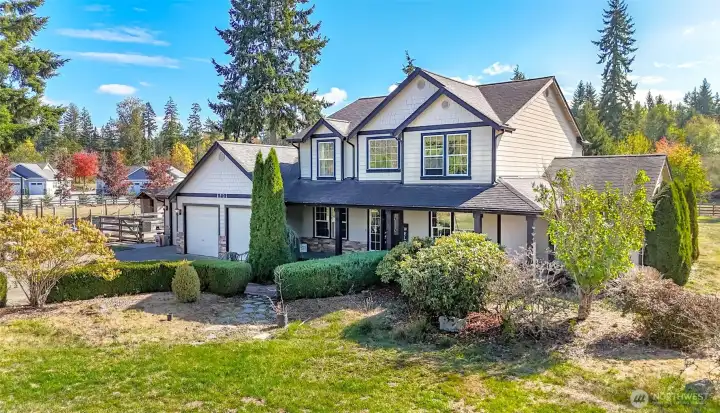 Custom built home on 10 acres with 3 car garage.