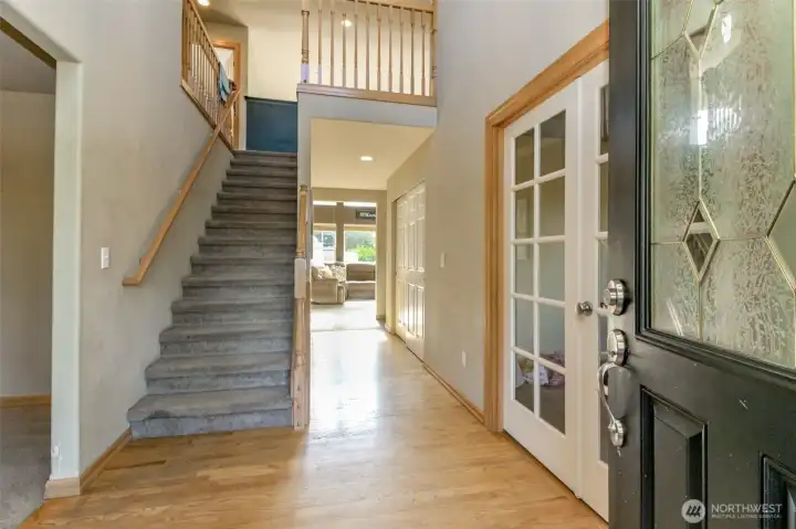 Entry through front door. The formal dining room is to the left of the entry and the office/den is to the right. Upstairs has two extra bedrooms, large bonus / loft room and full bathroom.