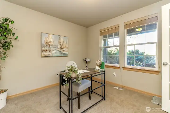 Den is at the front of the house and to the right of the front door as you enter. Double glass paned French doors for entry and the windows overlook the fully covered front porch.
