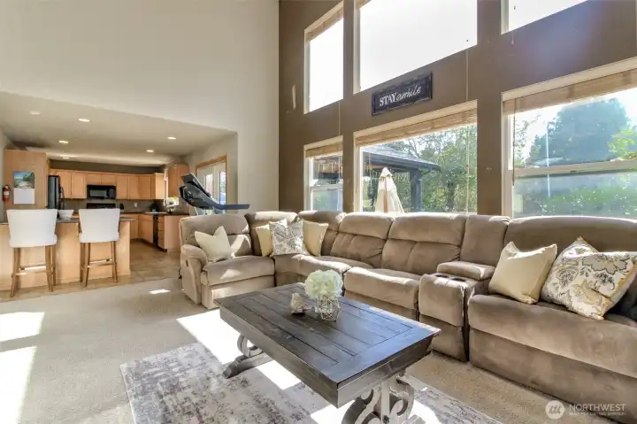 The family room has large picture windows offering tons of natural light and opens to the kitchen. Off the kitchen are French doors thaht leads to the expansive patio and has a partially covered area for year round grilling.